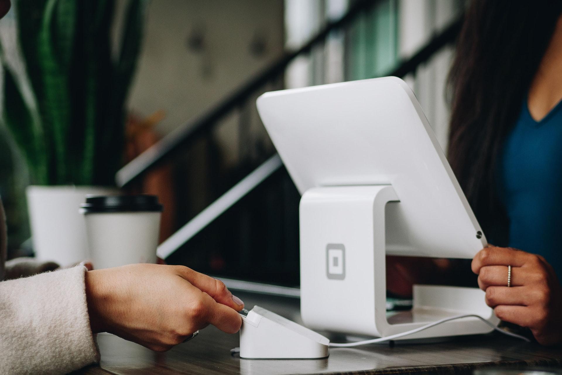 white monitor on desk